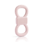 Aufrecht stehender, rosafarbener Beiß- und Lernring in Form einer 8. Die Oberfläche ist mit Noppen versehen und das Mittelstück ist geriffelt, um das Zahnfleisch zu massieren.