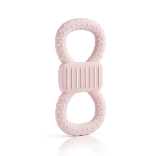 Aufrecht stehender, rosafarbener Beiß- und Lernring in Form einer 8. Die Oberfläche ist mit Noppen versehen und das Mittelstück ist geriffelt, um das Zahnfleisch zu massieren.